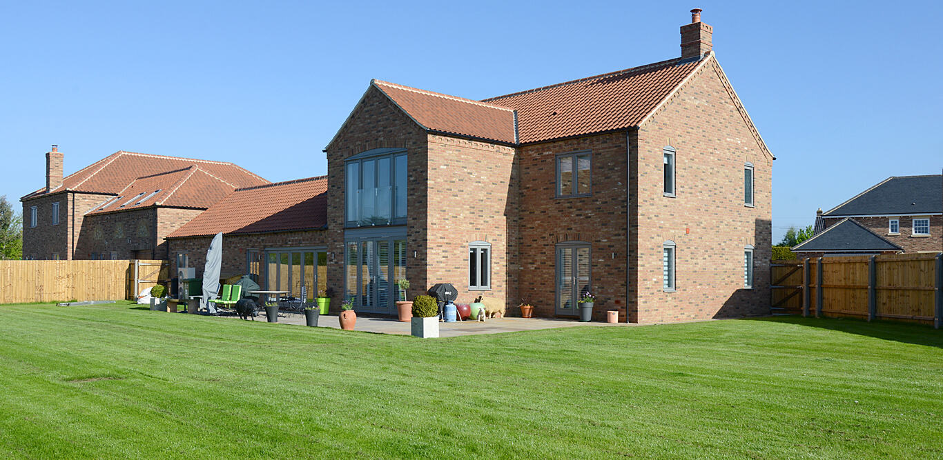 Brick home with full-height glazed gable